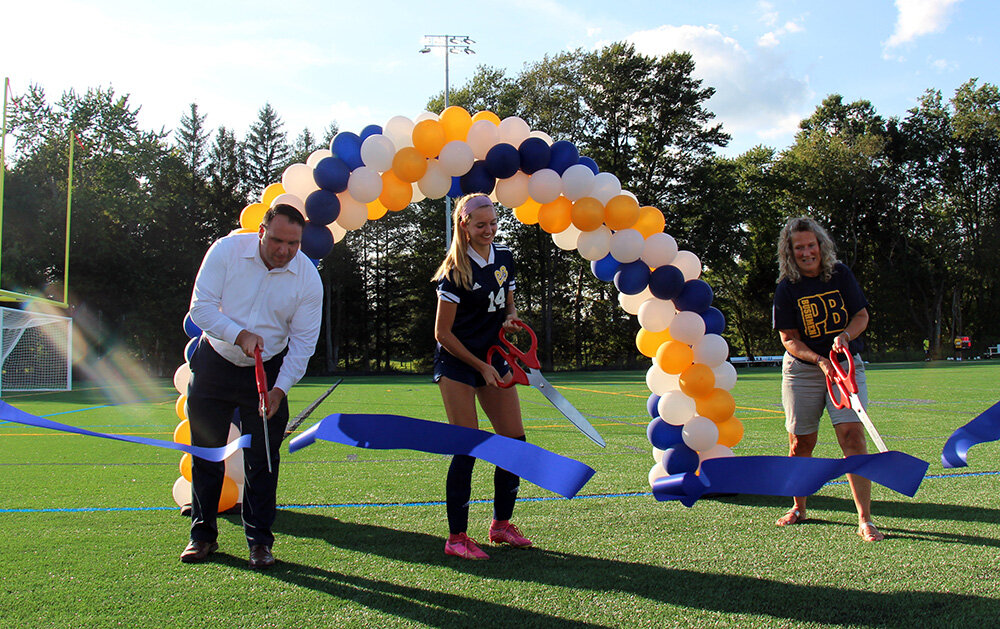 School District officials and athletes participated in the ribbon-cutting ceremony last week to dedicate the newly-refurbished athletic field at Pine Bush High School.